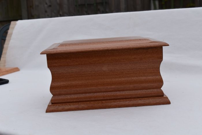 Mahogany casket with gold ring plaque side