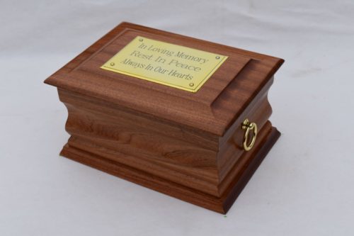 Mahogany casket with gold ring plaque top