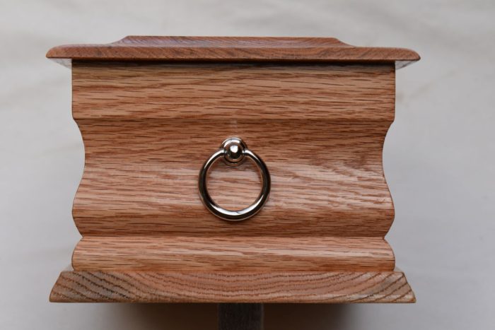 Oak casket with silver ring plaque end