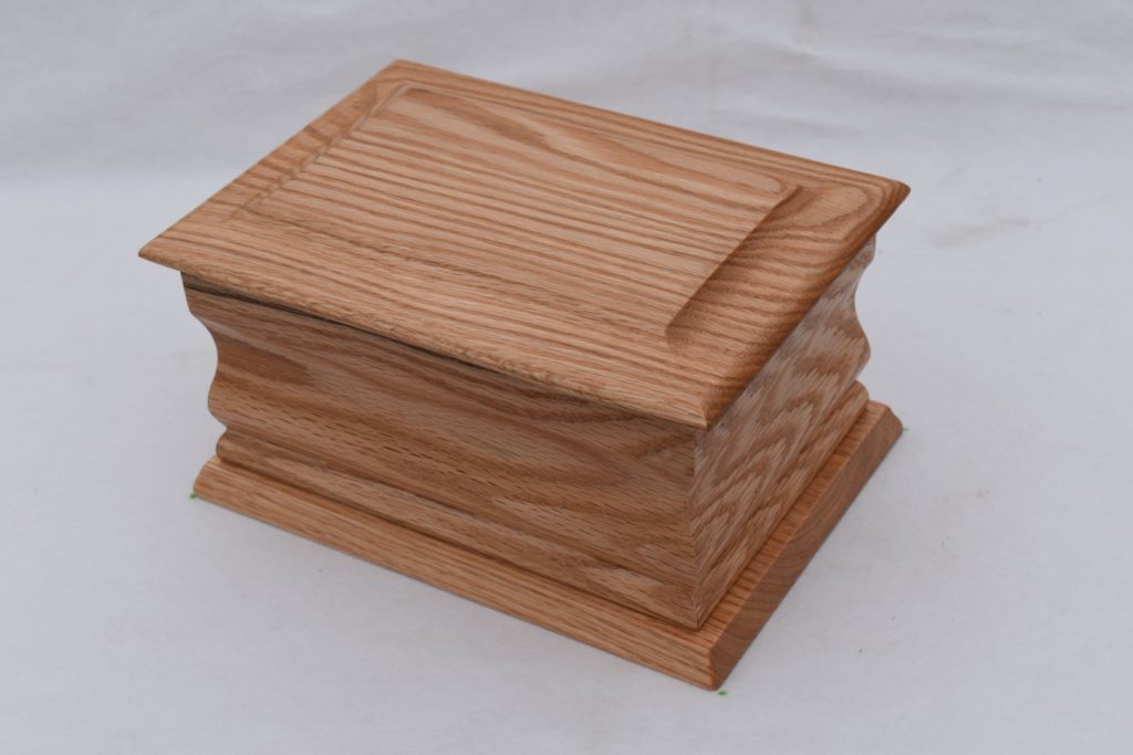 Plain oak moulded casket